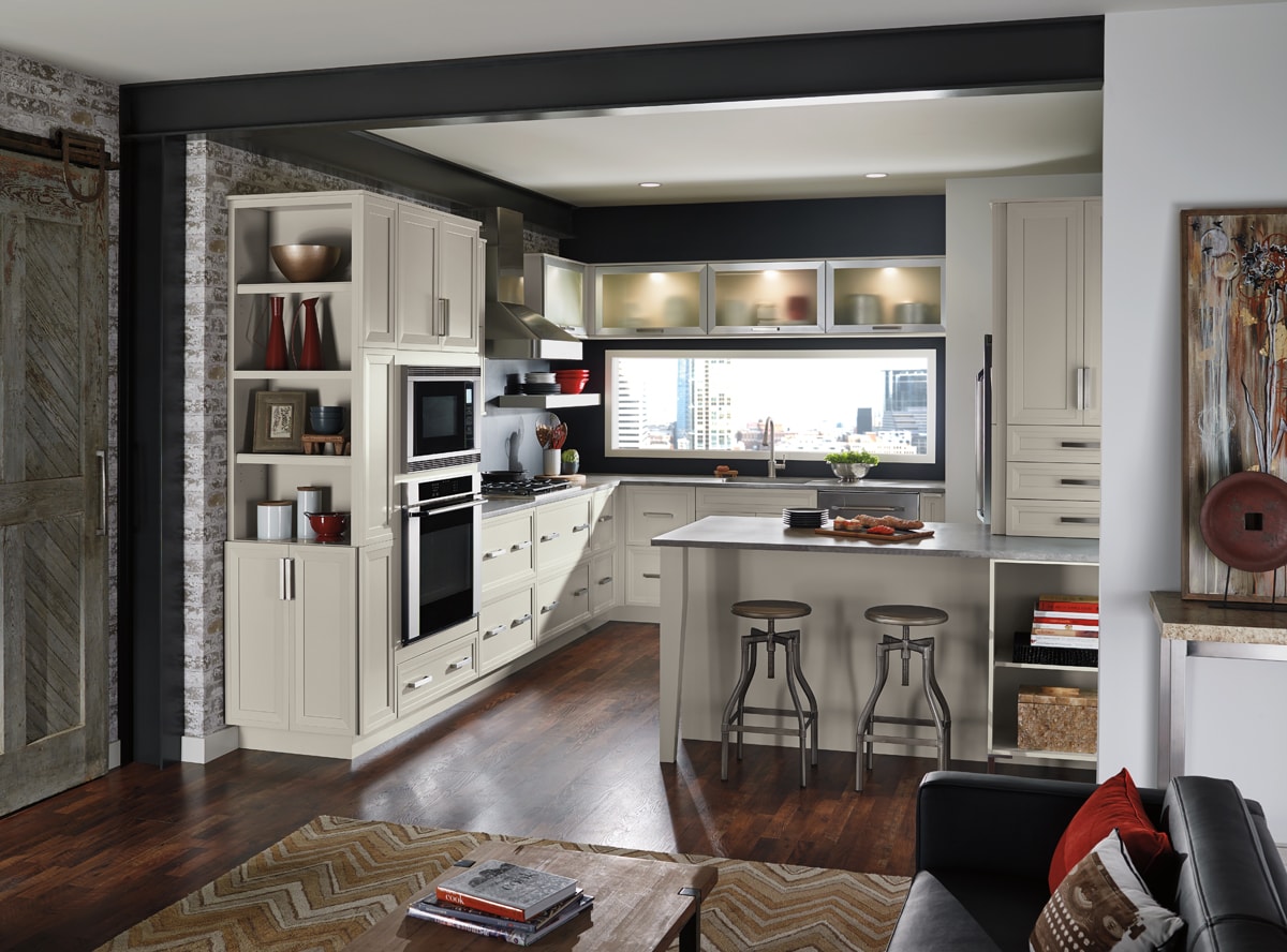 Loft style apartment with kitchen cabinets and bookshelves.