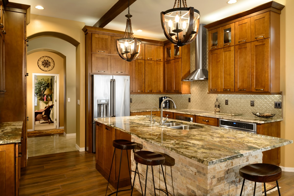 Tradtionally styled kitchen with rustic details and an archway entrance.