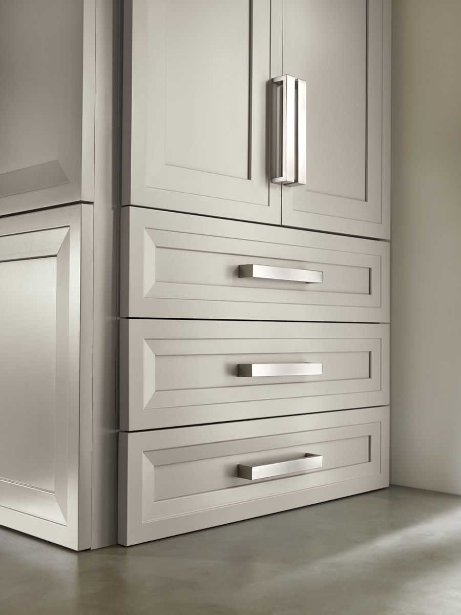 Large grey cabinets with chunky silver hardware.