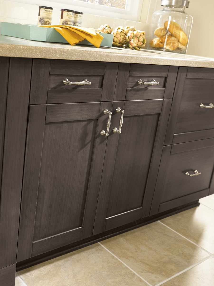 Slate colored cabinets with detailed brushed chrome hardware.