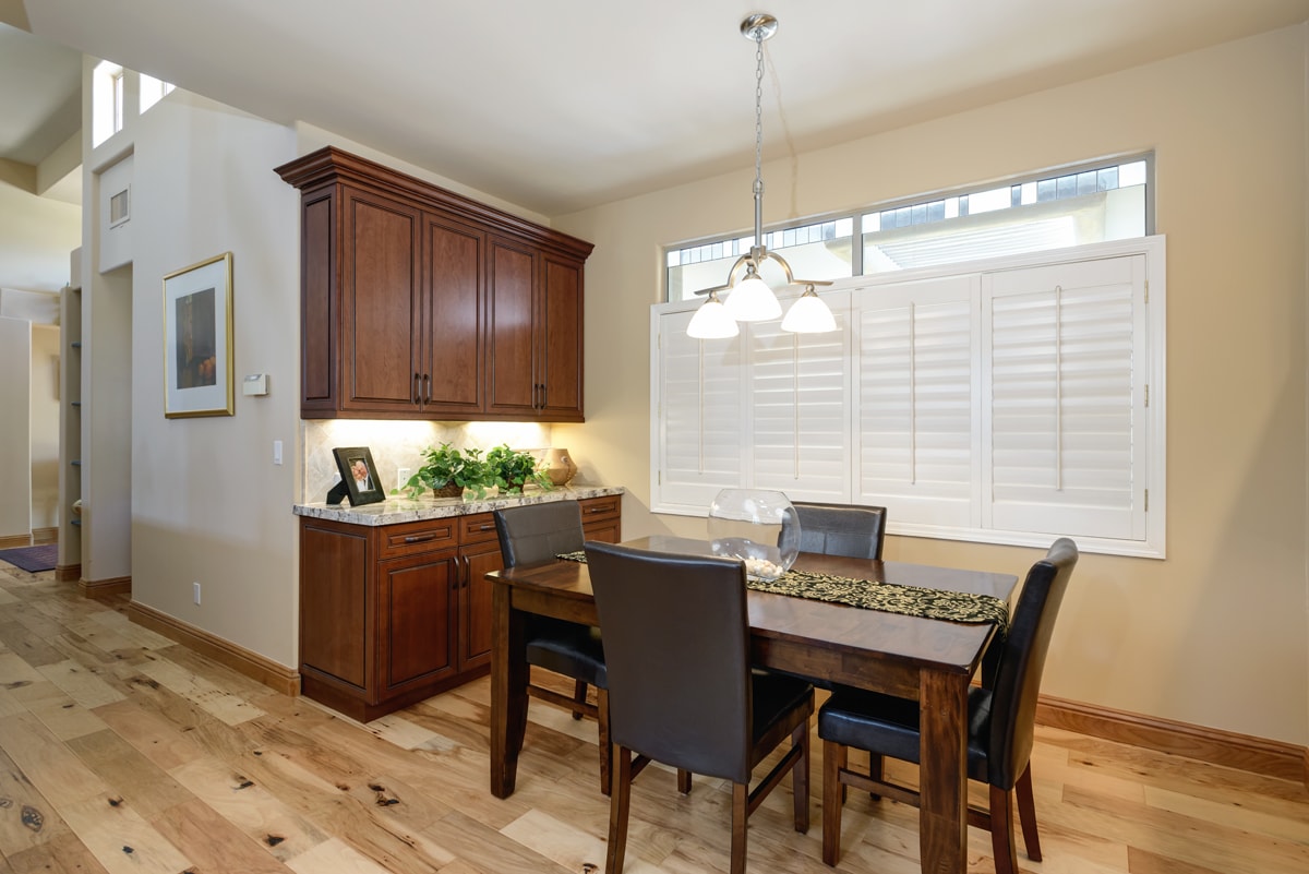 Dining room with upper and lower cabinetry.